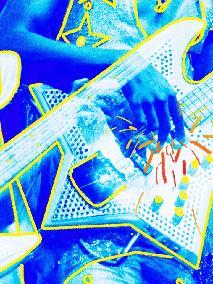 Close view of the rhinestone-covered star-shaped bass guitar.